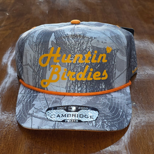 Hunting birdseed container with 'Hunting Birdies' text on a wooden surface
